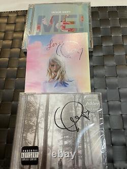Taylor Swift Autographed Hand Signed Lover and Folklore CD Albums